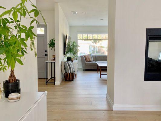 New addition interior: foyer, living room, and see-through fire place (from other side)