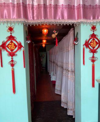 Entrance to curtained rooms.