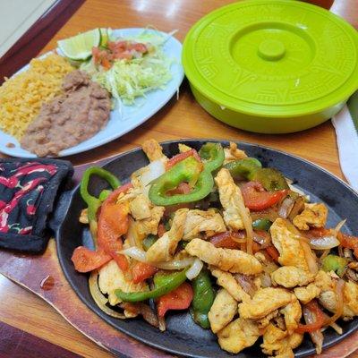 Steak, chicken, and shrimp fajitas