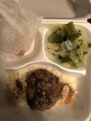 This is their Salisbury steak, rice and can anyone guess what that green side is SUPPOSED to be? No, cabbage.