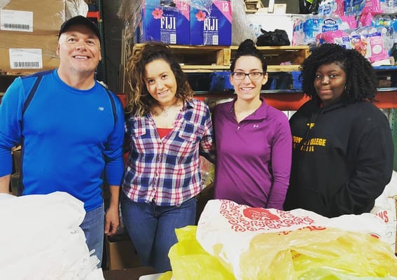 Volunteers assisting with food rescue efforts in CUMAC's warehouse