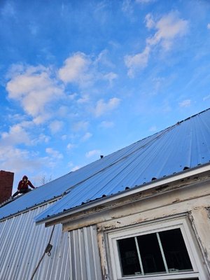 In progress corrugated metal roof.