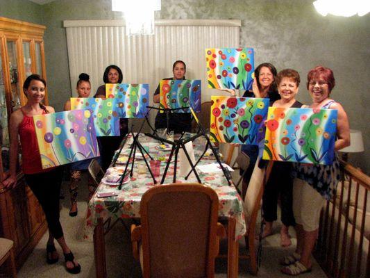 The finished paintings from one of my parties.  This was the "Flower Rainbow" painting.