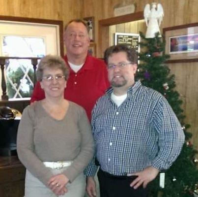 Myers Barbershop staff. Kathy, Chris, and Jason