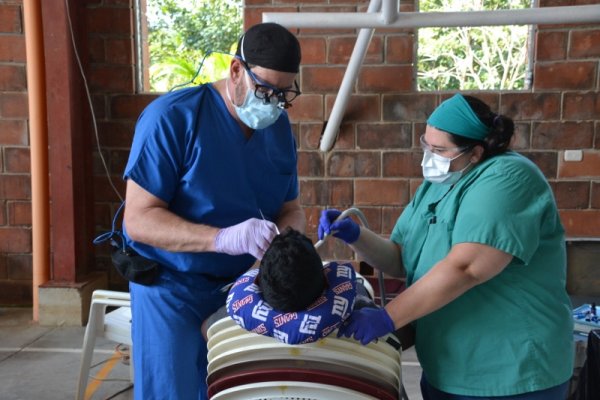 Dr. Heim giving back with his knowledge of dentistry.