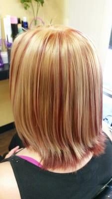 Blonde base with Red low lights. Razor cut and blow out.