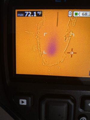 This is the infrared camera shot of the unfinished drywall, the dark spot is a possible active water leak.