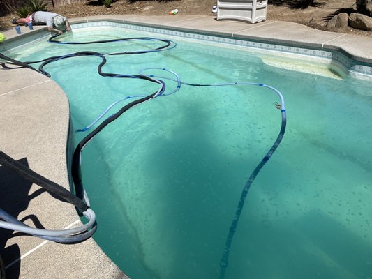 Almost time for the clean up. They cleaned up all the glass sand from the bottom and made the pool look like they were never here!