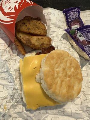 Bacon egg cheese biscuit and seasoned potatoes