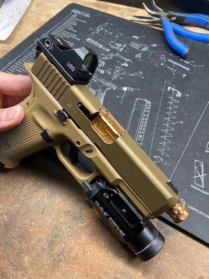 Custom gold barrel and upgrades on Glock.