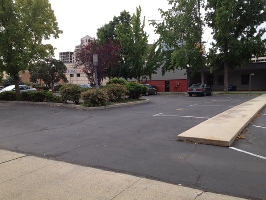 Unmarked lot where Republic Parking ticketed 3 of our vehicles. They say "The lot has several permit parking only signs."