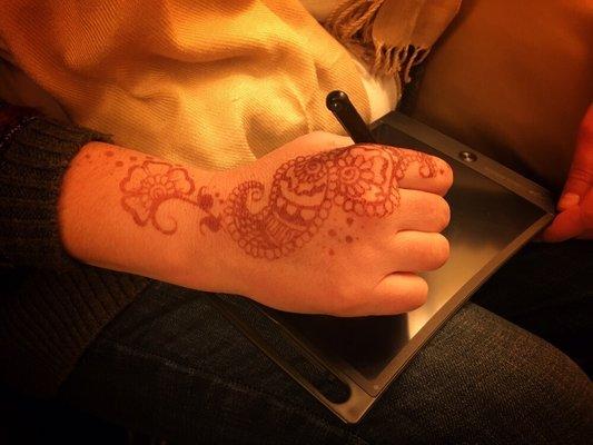 Henna in action!   Call for an appointment today!