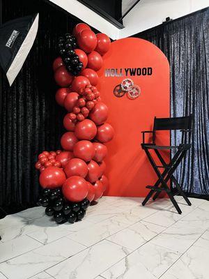 Hollywood backdrop and balloons.