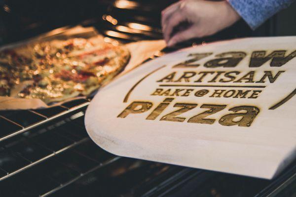 NW Trophy did the engraving on these custom pizza peels.  The Zaw logo you see etched into the wooden pizza peel was done really well by NWT