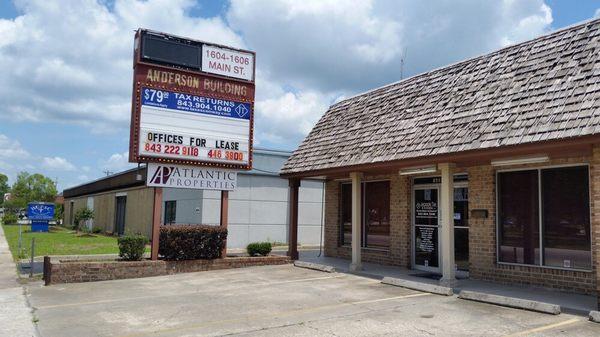 Store parking, sign and front.