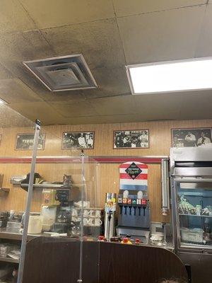 The ceiling tile around this vent near the cooking area is turning black.