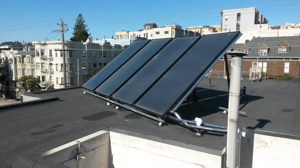 Solar thermal collectors in San Francisco for an apartment domestic hot water heating system.