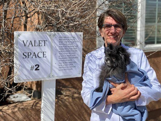 Dr. Fernyak by a Valet Space sign with a patient.