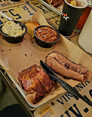 2 meat sampler plate with Moist Brisket and Ribs, served with coleslaw and baked beans.