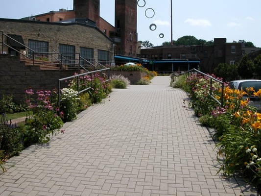 beautiful flowers leading up to open patio space!