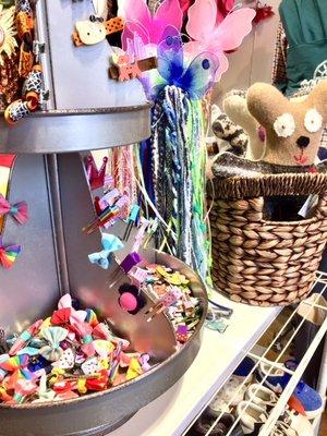 Bow-utiful hair clips and sweater bears on display.