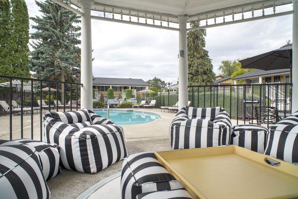 Gazebo with ample seating to relax and enjoy the amazing views provided by the vibrant outdoor pool