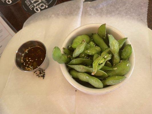 Don't often get sauce with edamame! But you do here for $6 on happy hour menu.