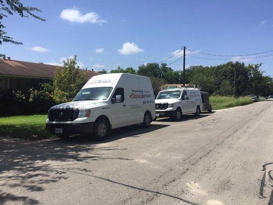 Classic Services vehicles at new residential AC system installation.