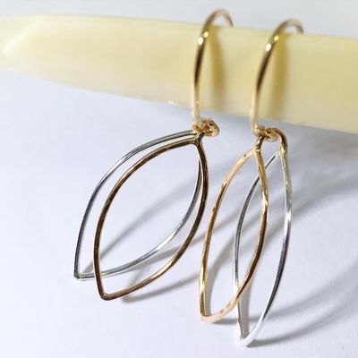 'New Leaf' earrings. 14/20 Gold-filled leaf with hammered surface is soldered to float atop Sterling Silver leaf.