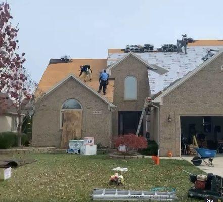 Our team working on a roof