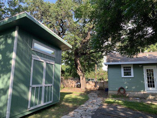 back of the house with our matching shed in the backyard