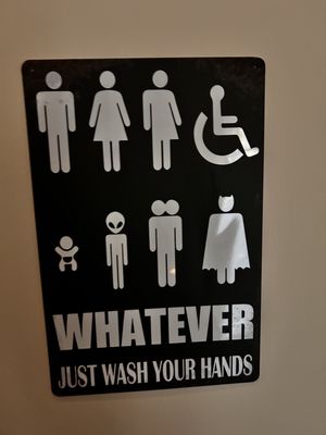 Loved the bathroom sign hated that their was no paper towels to dry my hands.