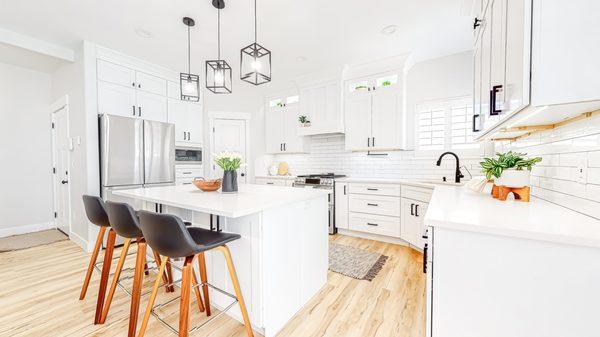 Remodeled kitchen area including island