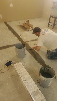 Preparing to lay vinyl plank flooring!