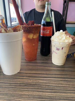 Left to right: papas locas, Rusa, Mexican Coca Cola, and Fresas con Crema