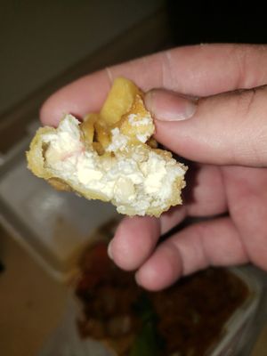 Inside of a crab cheese Rangoon.