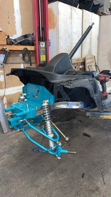 Golf cart front lift kit powder coated in teal.