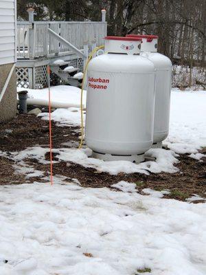 Propane tanks placed unsafely and directly on top of a septic tank.