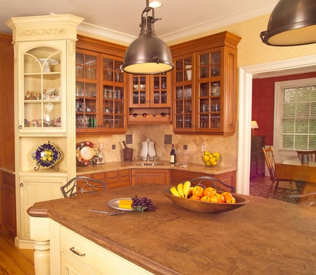 Royal Custom kitchen cabinets and concrete countertop on island.