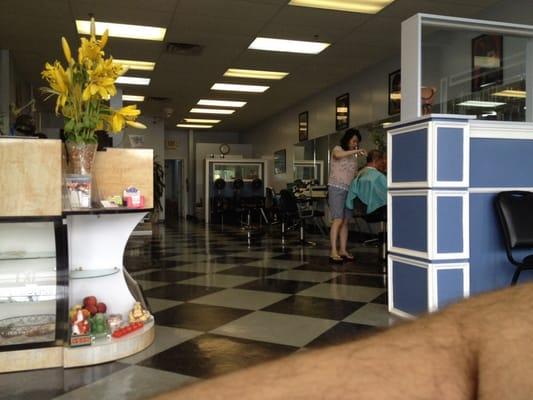 In the waiting area.  They keep the floors clean and I hear good conversations.