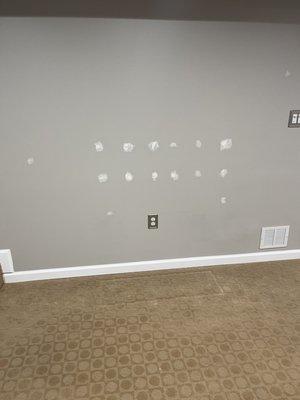 Had them remove a fixture before painting this wall gray. I had to go back and fill the holes before repainting.