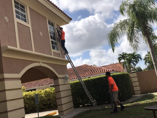 Exterior window washing techs on a commercial project.