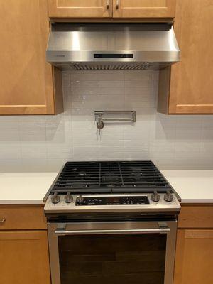 Gorgeous new modern backsplash with new pot filler!