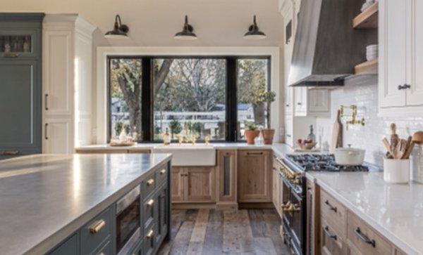 Three-tone cabinets with rustic White Oak base cabinets, white uppers, & painted green island. This kitchen has ALLL the organizer pullouts!