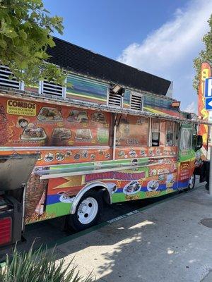 Side of truck with small shelf to eat