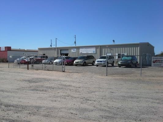 Our building, with a good sampling of the different vehicle makes and models we maintain/repair.