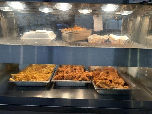 Warming case: (L-R on bottom) fries, chicken & catfish!