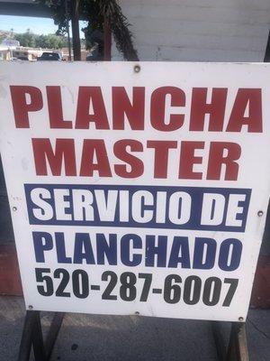 Sign in the parking lot. One of the cuter bilingual names - for the ironing (planchado ) service