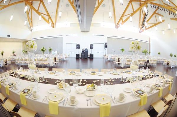 The Grand Ballroom Set up for a reception. The space comes with the option of round or rectangular tables to suit your preference.