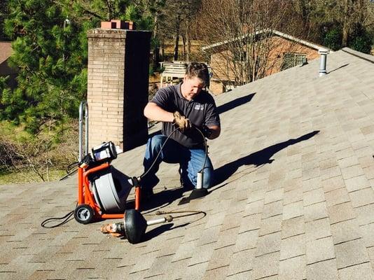 Drain cleaning from roof vent